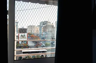 a view of a city from a window at Palmarejo, Apartamento T1, frente Praça Center in Praia