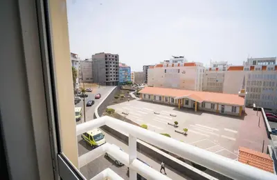 a view of a city street from a balcony at Cozy and beautiful apartment! in Praia