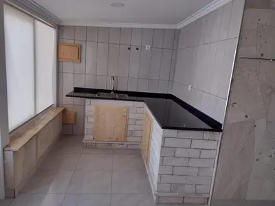 an empty kitchen with a sink and a counter at Moreira Estates