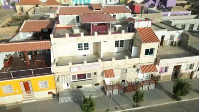 an overhead view of a white building with red roofs at Moreira Estates