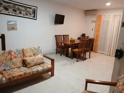 a living room with a couch and a table at Paraiso 162E in Santa Maria