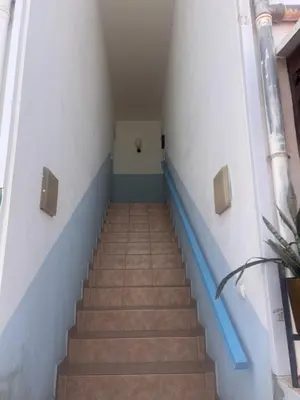 a staircase in a building with blue and white walls at Paraiso 162E in Santa Maria