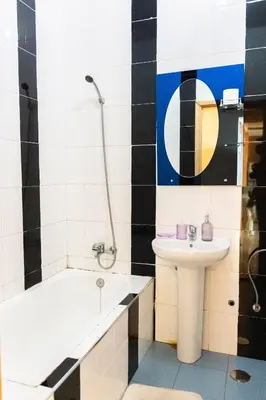 a bathroom with a sink and a tub and a toilet at Apartamento T1 em Palmarejo, Trás de pão quente in Praia