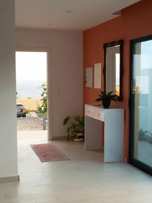 a bathroom with a sink and a mirror in a room at Blue Coast Villas - Villa 6 in Cidade Velha