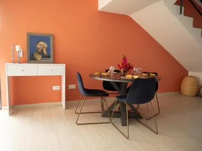 a dining room with a table and two chairs at Blue Coast Villas - Villa 6 in Cidade Velha