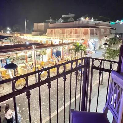a view of a carnival from a balcony at night at Urban Studio Plaza 6 in Santa Maria