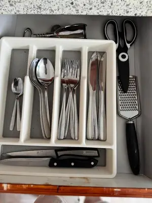 a white tray with utensils in a drawer at Murdeira V17 I by RPG Group in Beirona