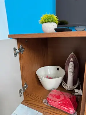 a shelf with a white bowl and a plant on it at Murdeira V17 I by RPG Group in Beirona