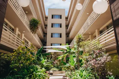 an indoor garden in a building with plants at Pôr D'Sôl Mindelo in Lazareto