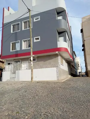 a building on the side of a street at Casa da Sara Guest House in Mindelo