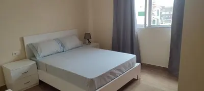 a white bed in a bedroom with a window at Sams House in Espargos