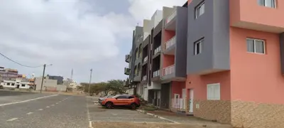 a car parked in a parking lot next to a building at Sams House in Espargos