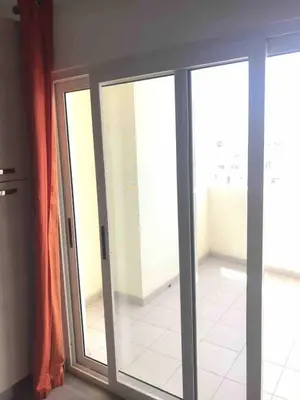 a sliding glass door in a room with a window at Kite & Chill Sal Rei in Sal Rei