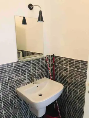 a bathroom with a white sink and a mirror at Kite & Chill Sal Rei in Sal Rei