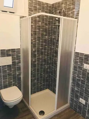 a bathroom with a shower with a toilet at Kite & Chill Sal Rei in Sal Rei