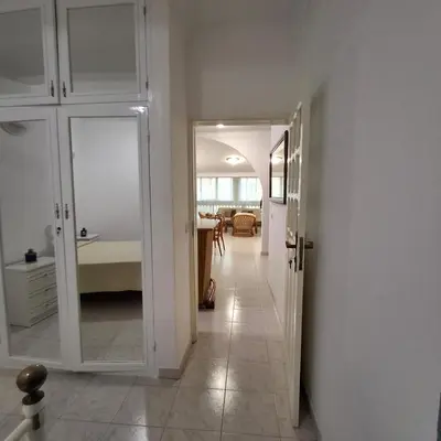 a hallway with a door leading to a bedroom at HOSTEL Terra Branca in Praia