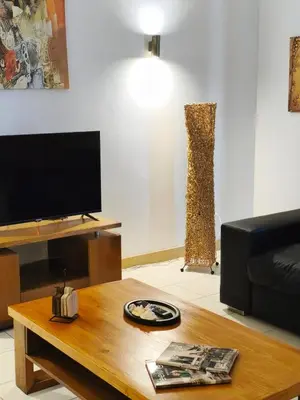 a living room with a couch and a table at HostySpot - Vila Verde Resort in Santa Maria