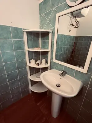 a bathroom with a sink and a mirror at Casa Relaxa in Sal Rei