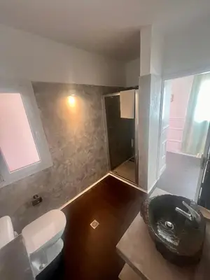 a bathroom with a shower and a toilet and a sink at Casa Relaxa in Sal Rei