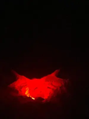 a red object is lit up in the dark at Casa Relaxa in Sal Rei