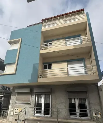 a building with balconies on the side of it at Pensao Restaurante Recanto in Tarrafal