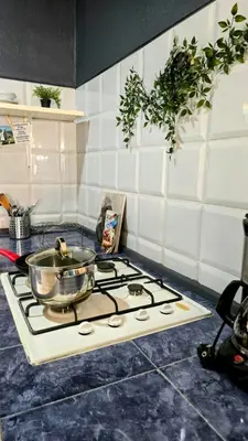 a pot sitting on top of a stove in a kitchen at Celina's Cozy Studio & Beach Life in One in Santa Maria