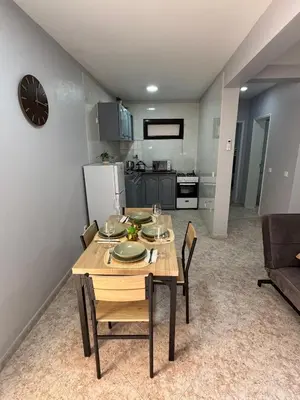 a kitchen and dining room with a table and chairs at Doce de Sal in Santa Maria