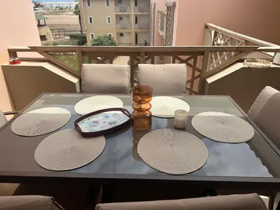 a table with hats and candles on a balcony at Tropical Mediterraneo in Santa Maria