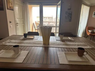 a wooden table with plates and cups on top of it at Tropical Mediterraneo in Santa Maria