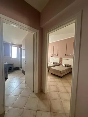 a room with a bed and a large doorway at Tropical Mediterraneo in Santa Maria