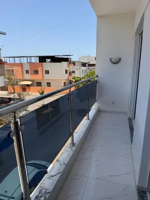a balcony with a view of a building at Appartement Praia Sao Felipe in Praia