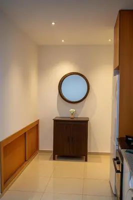 a kitchen with a round window on the wall at Cantinho dos Dias in Espargos