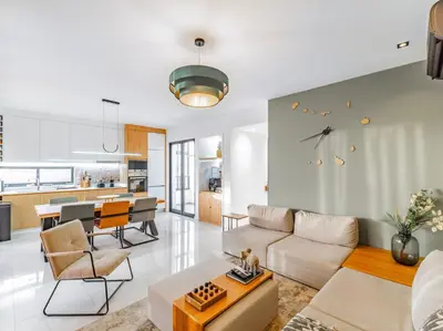a living room with a couch and a table at Suncent apartment in Mindelo