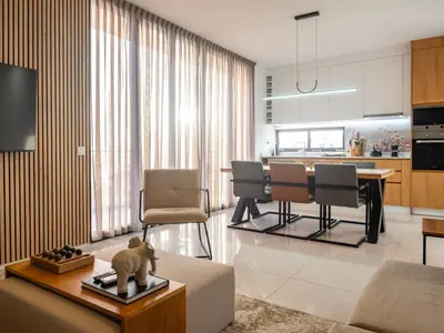 a living room with a couch and a table at Suncent apartment in Mindelo