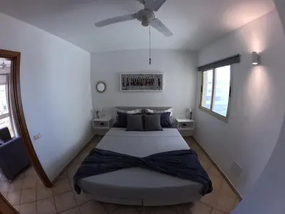 a bedroom with a bed and a ceiling fan at Miguel House in Santa Maria
