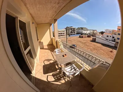 a view of a balcony with a table and chairs at Miguel House in Santa Maria