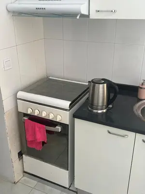 a kitchen with a stove with a pot on it at Casa Ida 1 Tarrafal, Santiago, Cabo Verde in Tarrafal