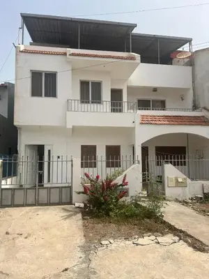 a white house with a fence in front of it at Casa Ida 1 Tarrafal, Santiago, Cabo Verde in Tarrafal