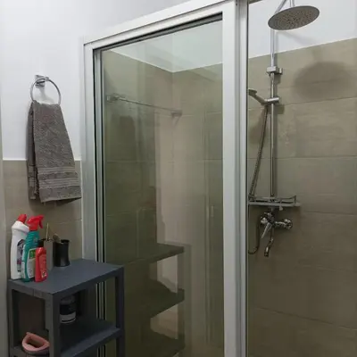a shower with a glass door in a bathroom at Boavista Estoril Residence Sol & Mar in Sal Rei