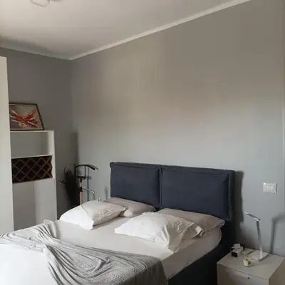 a bed with a blue headboard in a bedroom at Boavista Estoril Residence Sol & Mar in Sal Rei