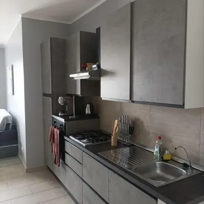 a kitchen with a sink and a stove at Boavista Estoril Residence Sol & Mar in Sal Rei