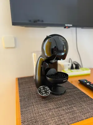 a coffee maker sitting on top of a table at Murdeira V31 G by RPG Group in Beirona