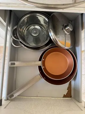 a bunch of pots and pans in a drawer at Murdeira V31 G by RPG Group in Beirona