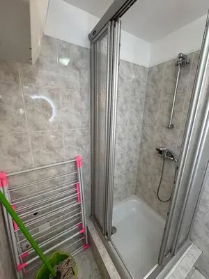 a bathroom with a shower and a bath tub at Murdeira V 31 H by RPG Group in Beirona