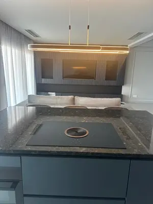 a laptop on a counter in a room at Boa Vista Apartment in Prainha