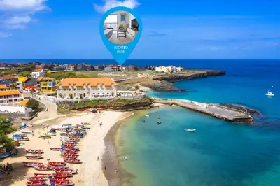 an aerial view of a beach with a blue marker at Cozy apt amazing seaview - 2 min from beach - LCGR in Tarrafal