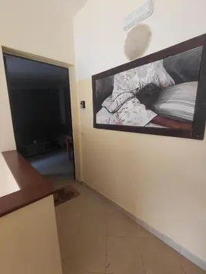 a living room with a painting on the wall at Casa Mendonça in Santa Maria