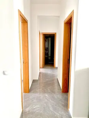 an empty hallway with two doors and a hallwayngth at APARTAMENTO 403 T2 Centro de Sal Rei, Boavista in Sal Rei