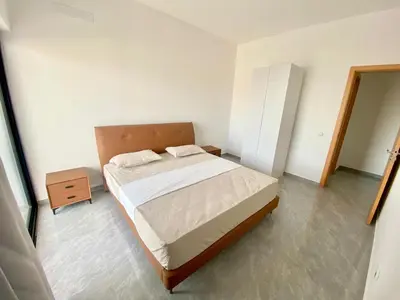 a bedroom with a bed and a dresser in it at APARTAMENTO 403 T2 Centro de Sal Rei, Boavista in Sal Rei