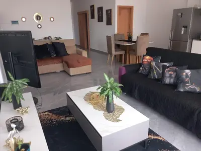 a living room with two couches and a table at Sal Rei ,Boavista Magic Apartment - in Sal Rei